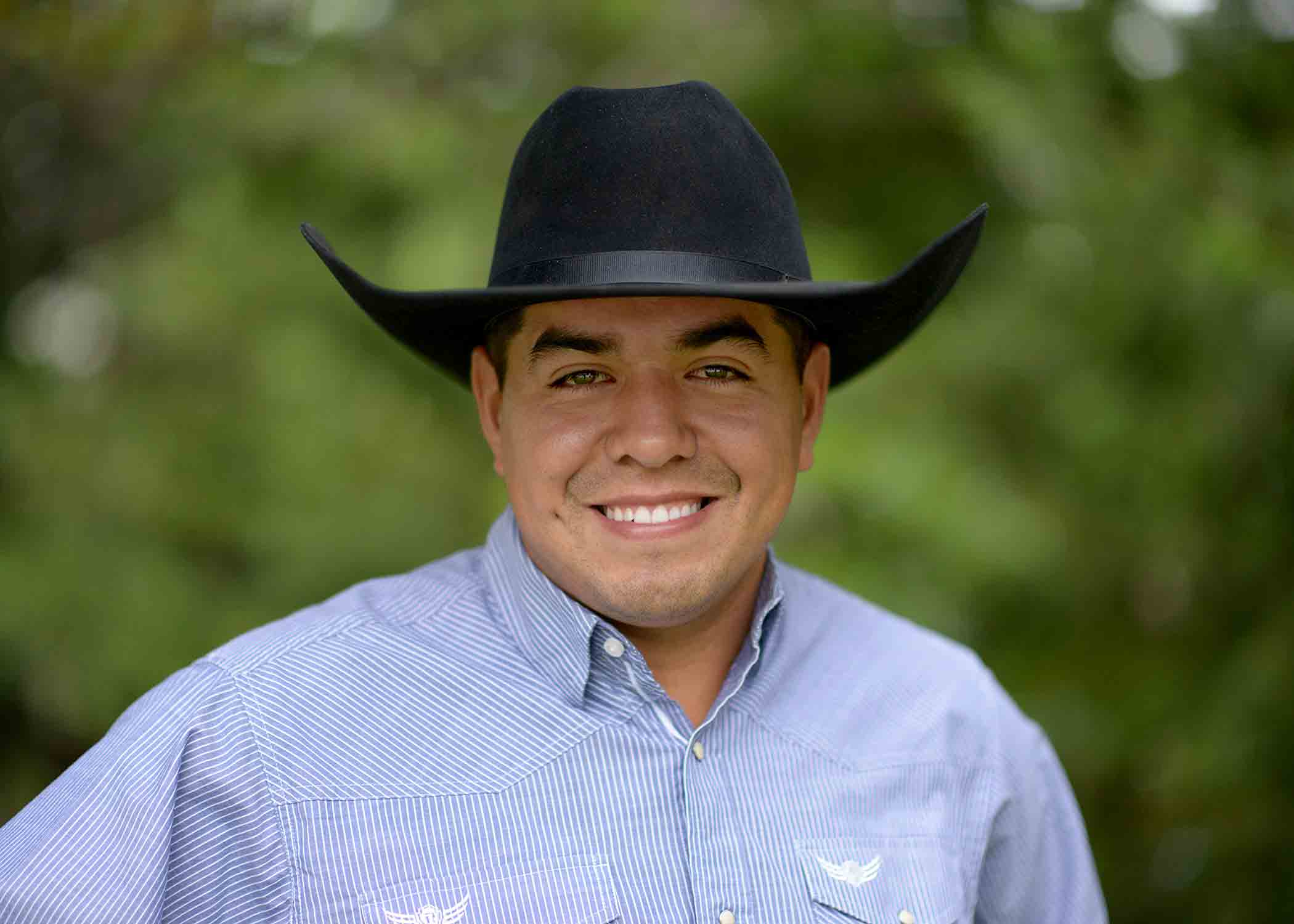 Portrait of Rafael Velazquez-Ramos in a dark cowboy hat