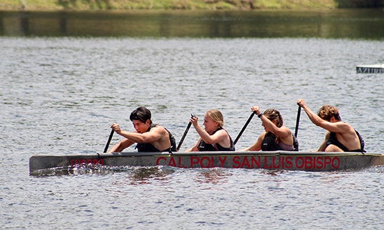 Cal Poly students paddling as a team in their concrete canoe