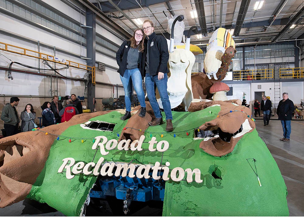 Rose Float team presidents Annie Doody of Cal Poly San Luis Obispo and the Ryan Ward of Cal Poly Pomona pose atop the float