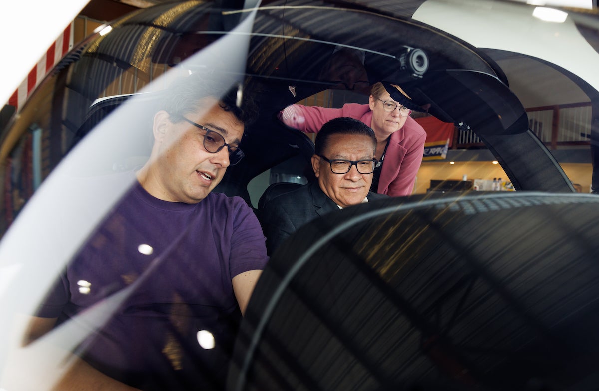 Congressman Carbajal sits in the airplane with Dean Fleischer and Professor Iscold