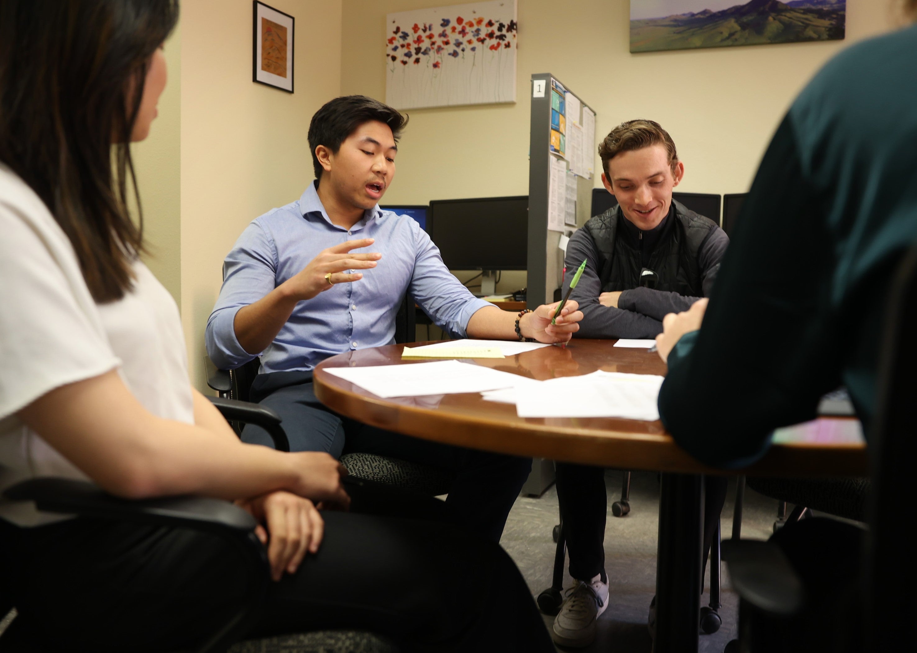 Nathan Nguyen speaks during a student leadership meeting at the Low Income Taxpayer Clinic