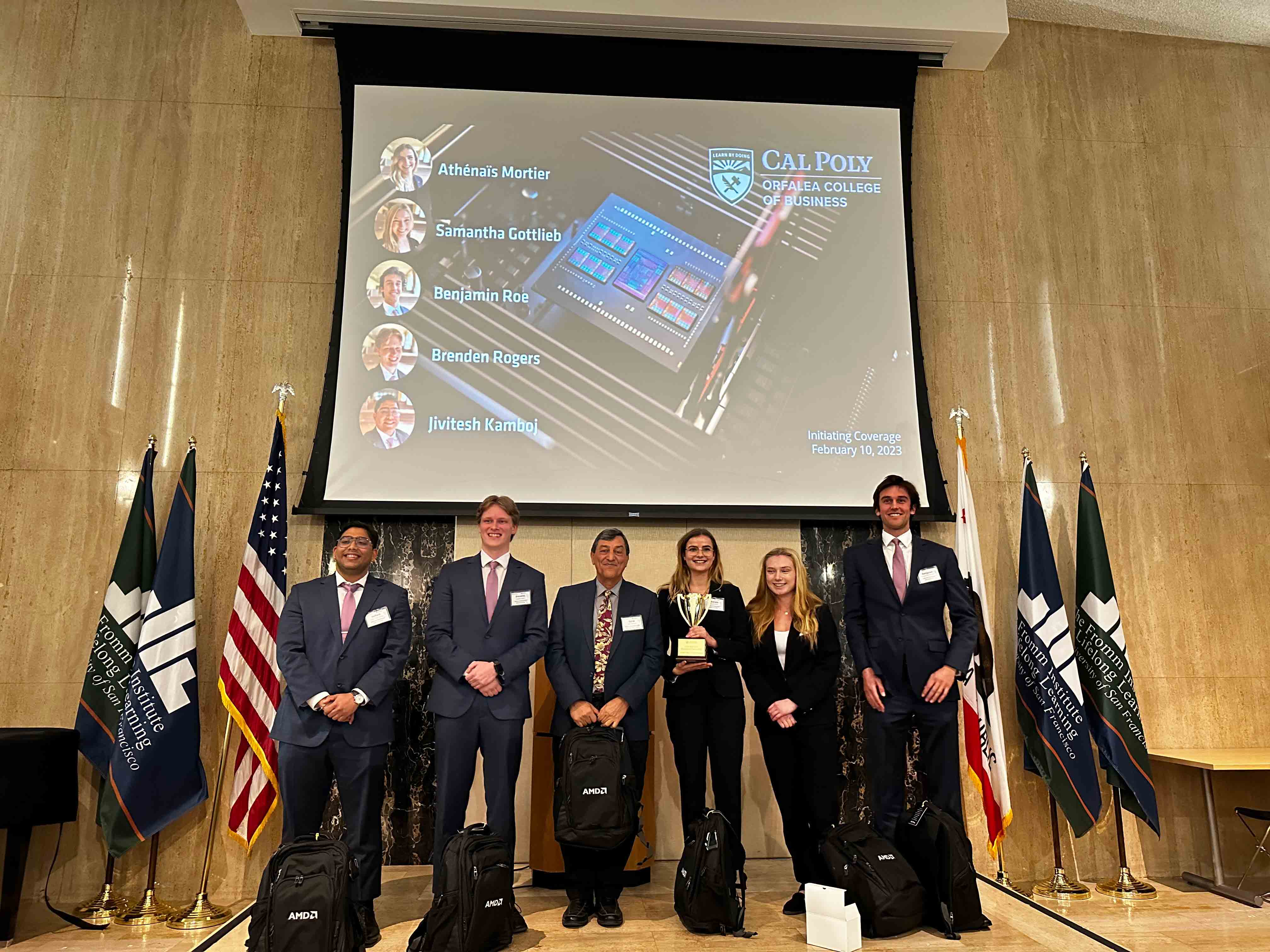Members of Cal Poly’s finance team pose for a photo on stage after their first-round victory in San Francisco