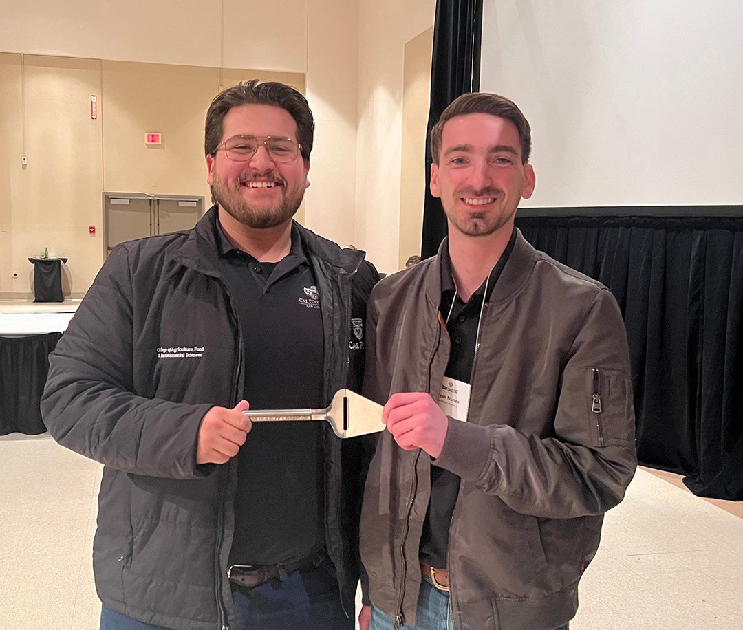 Two eddy Lopez, left, Two Cal Poly agricultural science majors share award for Triple Peak brie