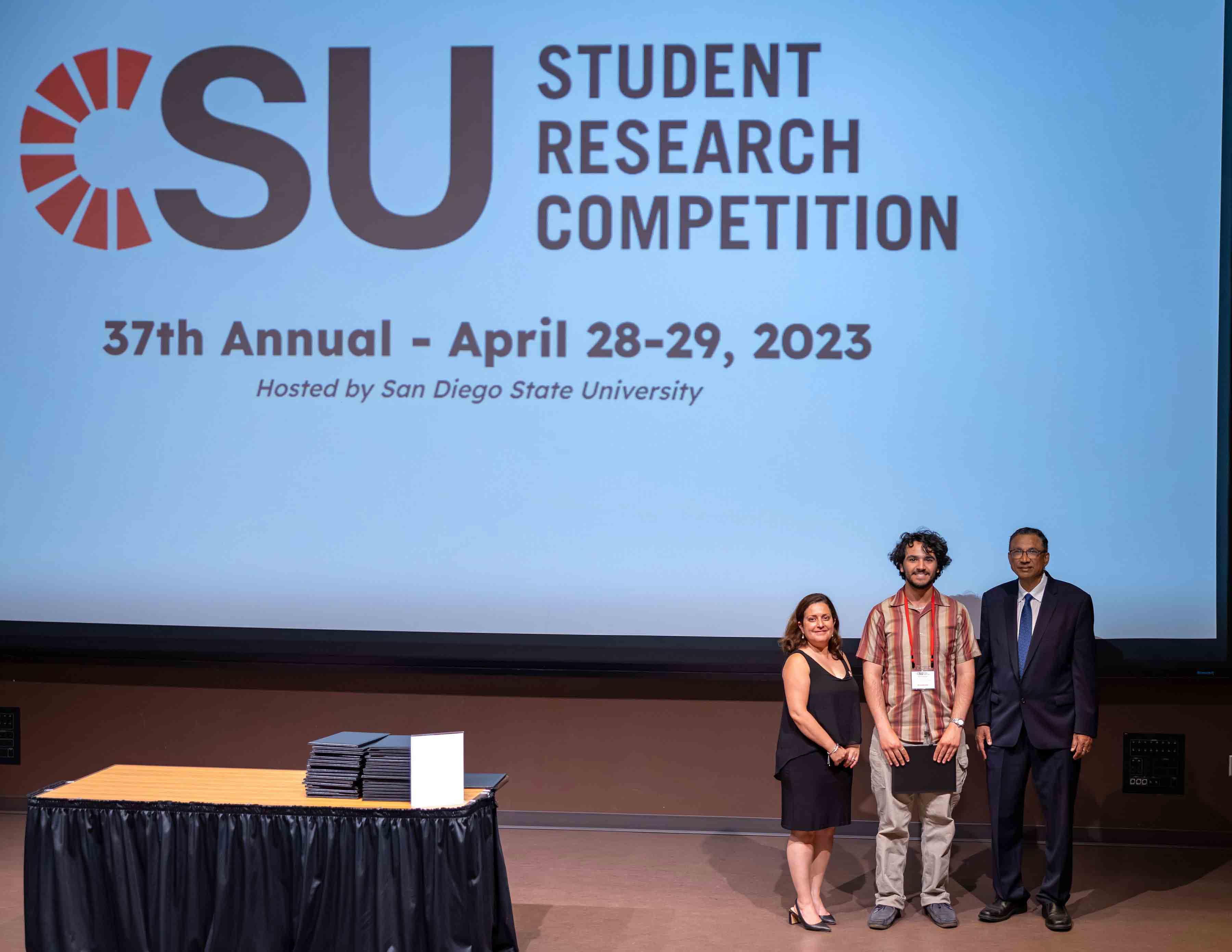 Ethan Gutterman at the CSU Student Research Competition with CSU and SDSU representatives