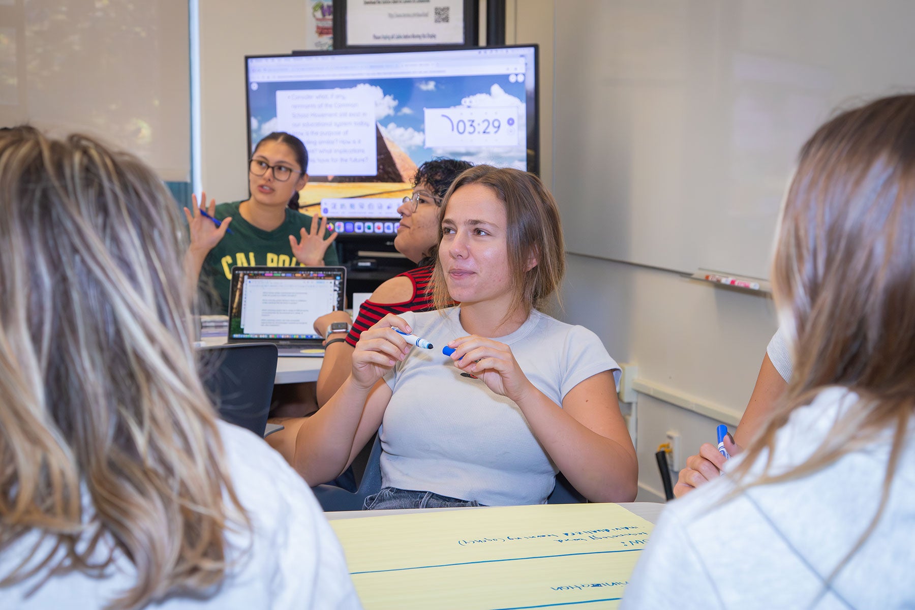 Cal Poly education students discuss core education principles during a class