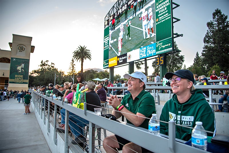 Cal Poly football fans enjoy watching a game last fall from the Cal Poly Partners Plaza on the north end of the stadium.