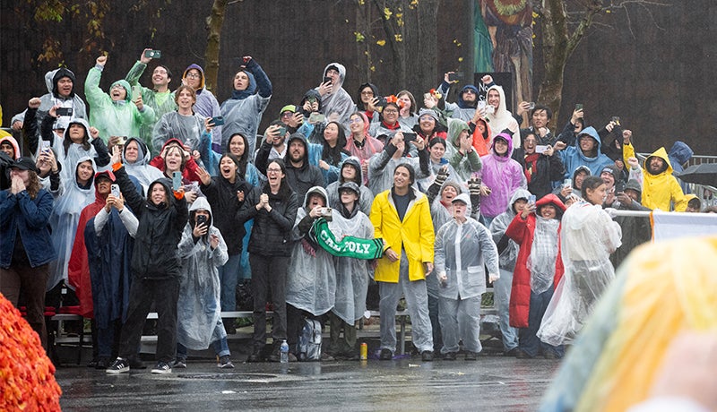 Cal Poly Rose Float team members, fans and alumni of the program cheer the award winner