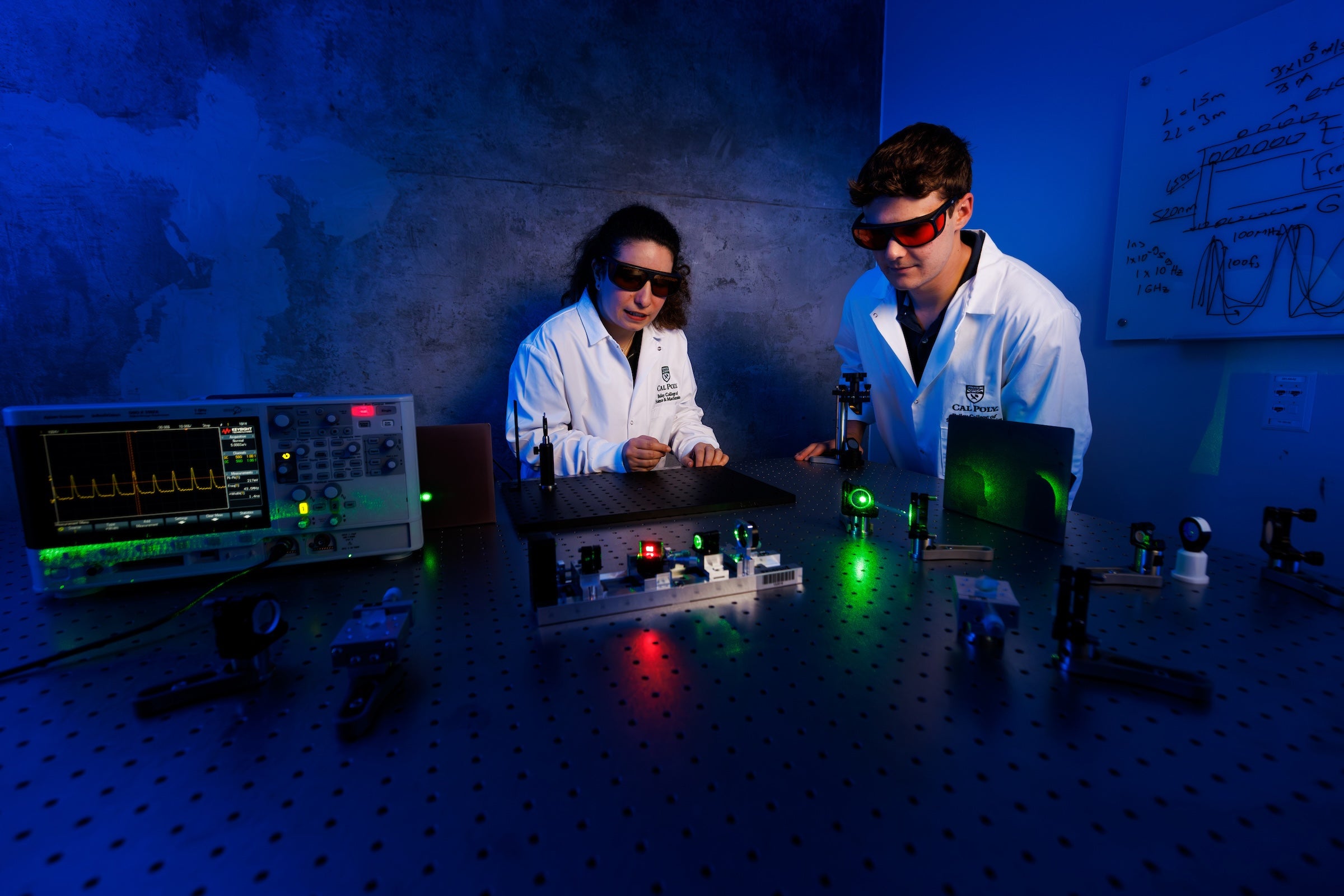 Assistant Professor Isinsu Toker collaborates with student James Mauck on the first laser setup built at Cal Poly