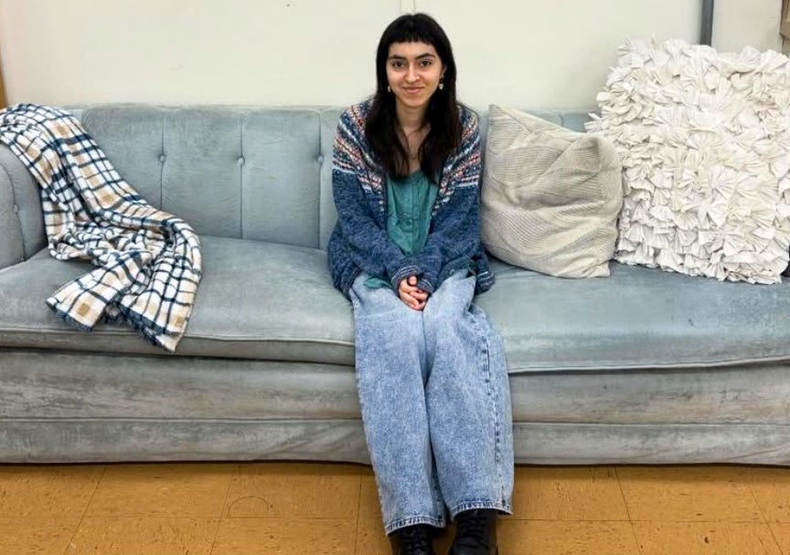 Artist and Central Coast resident Alexa Valenzuela on the studio blue couch