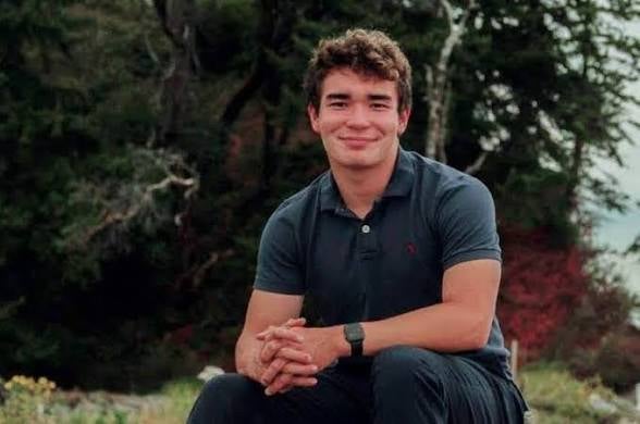 Sean Hillman sits for a portrait near the waters of Puget Sound