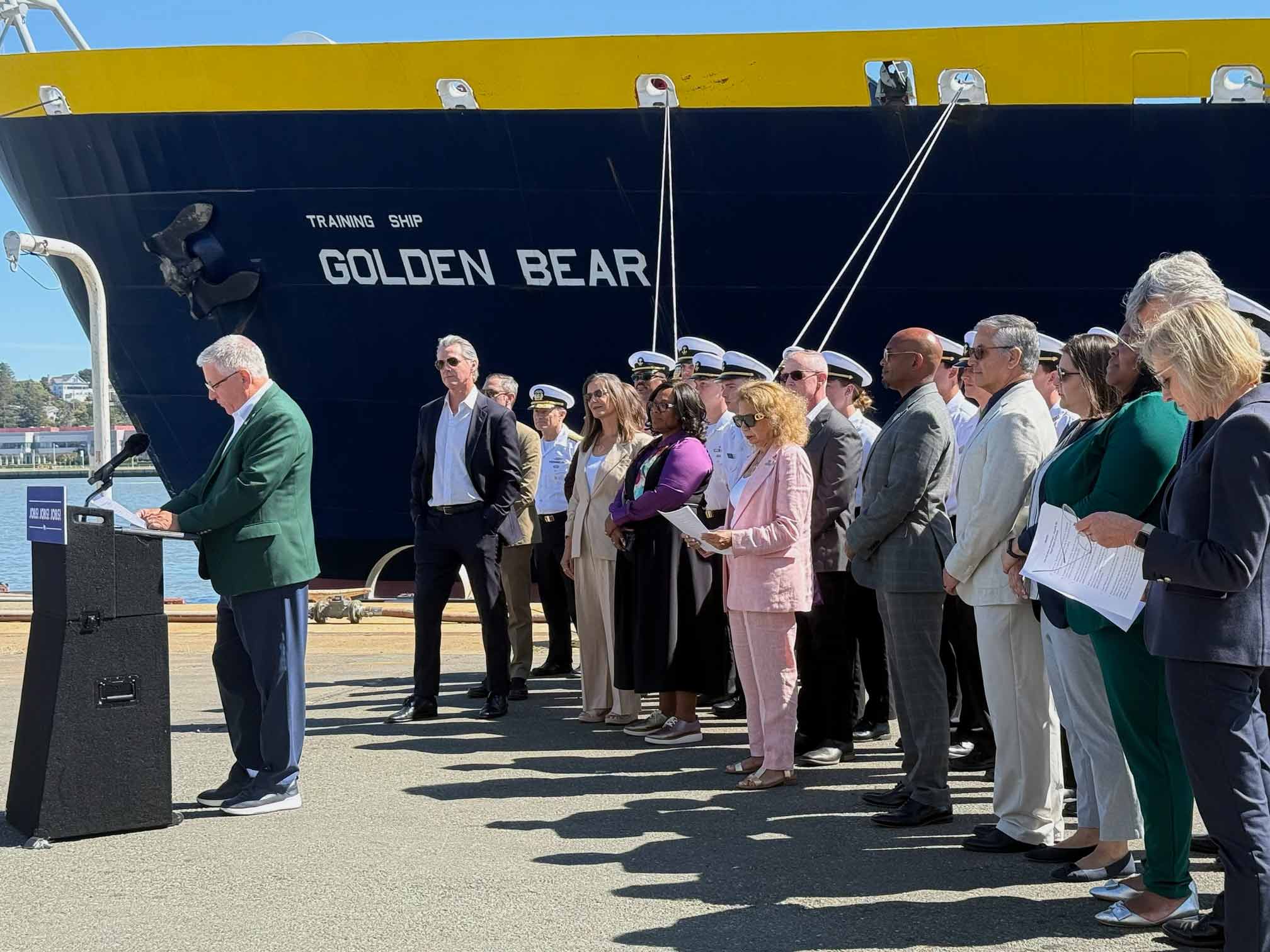 Cal Poly President Jeffrey D. Armstrong speaks as Gov. Gavin Newsom and other state, CSU and&nbsp;university&nbsp;leaders look on, with the Training Ship Golden Bear in the background.