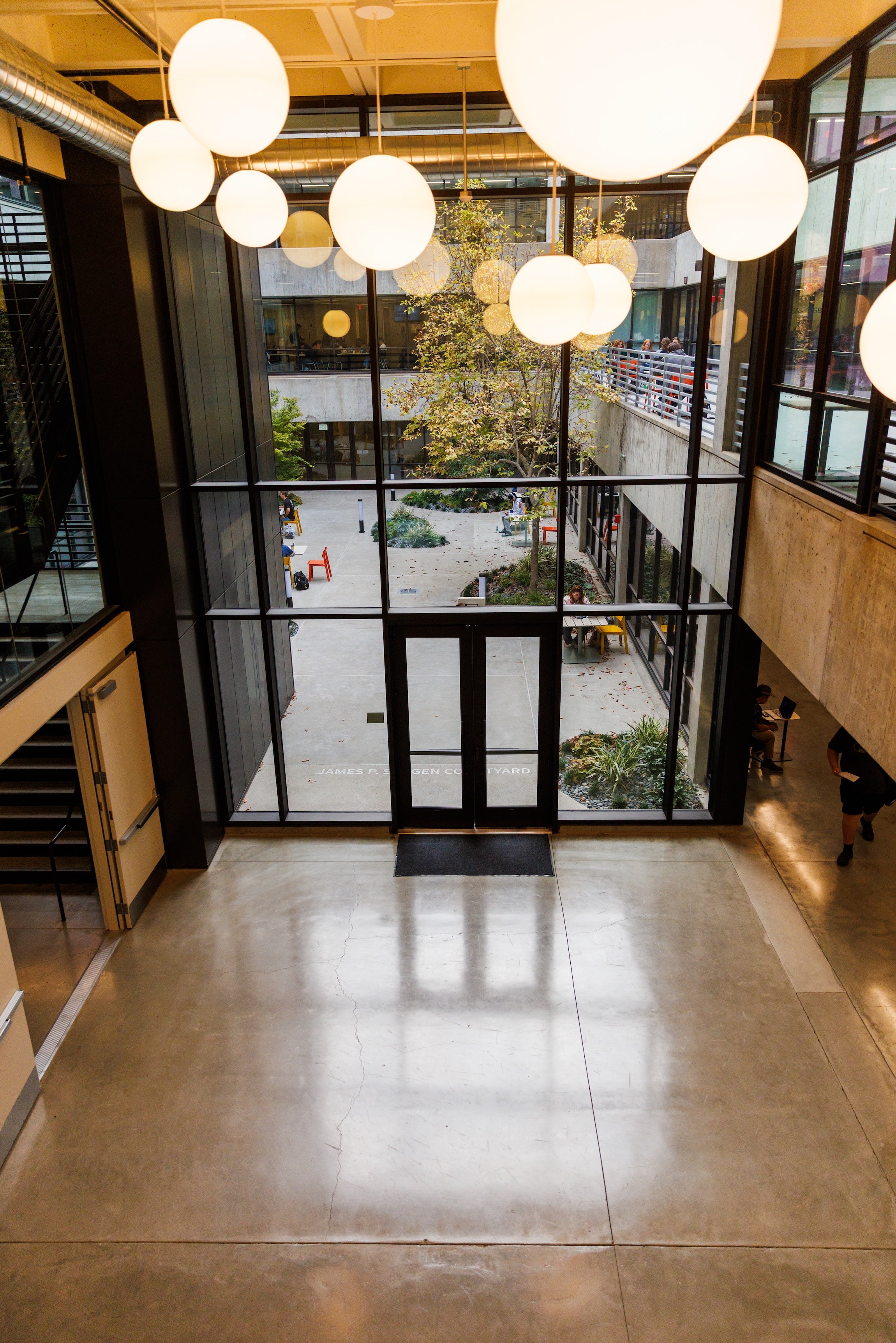 A view of the lobby of Kennedy Library looking towards the door to the library's courtyard.