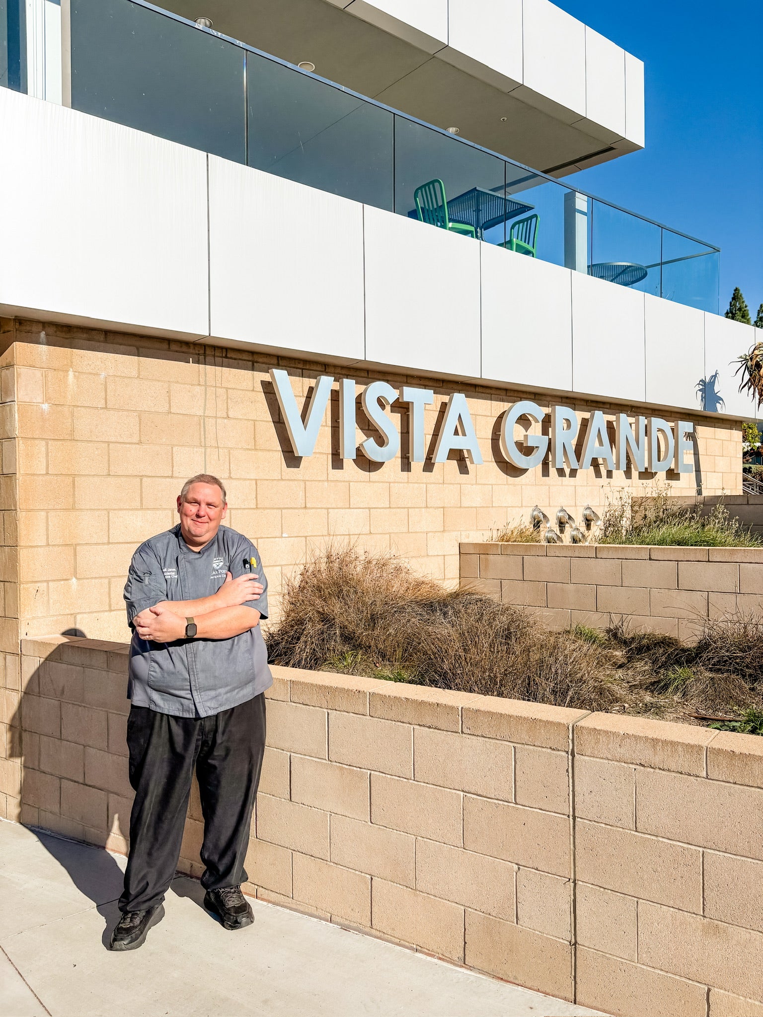 Cal Poly Campus Dining Executive Chef Darrell Janes poses in front of the Vista Grande Dining Complex