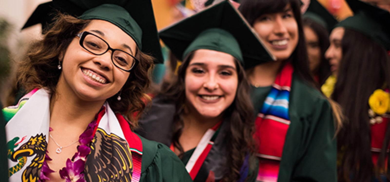A crowd of campus community members gather outside of Cal Poly’s University Union Plaza to enjoy a group of Ballet Folklorico dancers