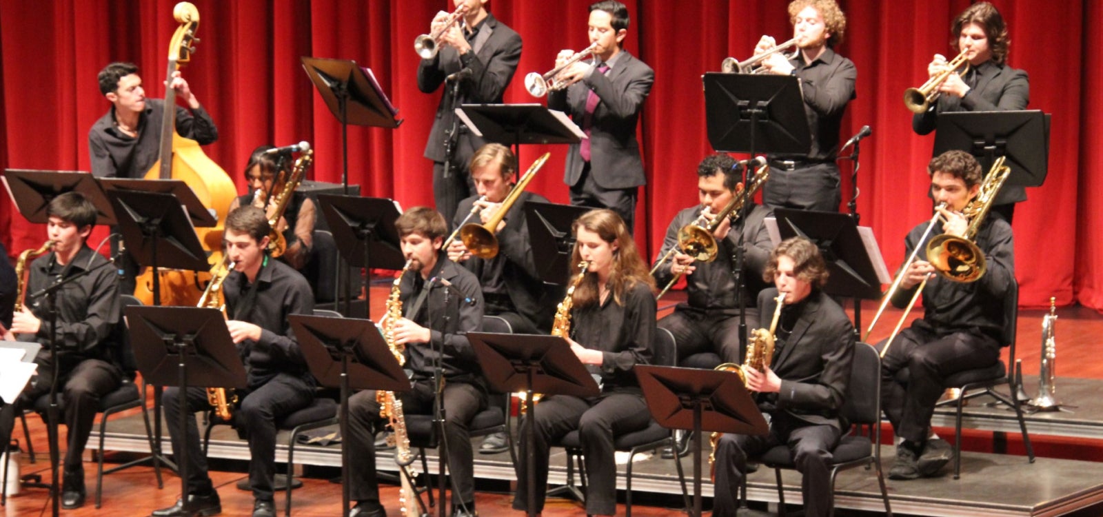 The University Jazz Band that features 13 student musicians perform on stage