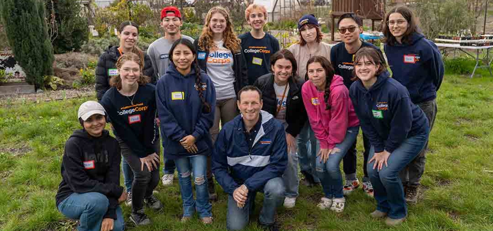 A group of College Corps members assemble for a photo