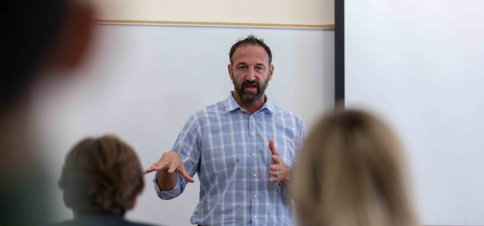 Randy Rovegno talks to students in his marketing projects class that he calls the Athlete Lab