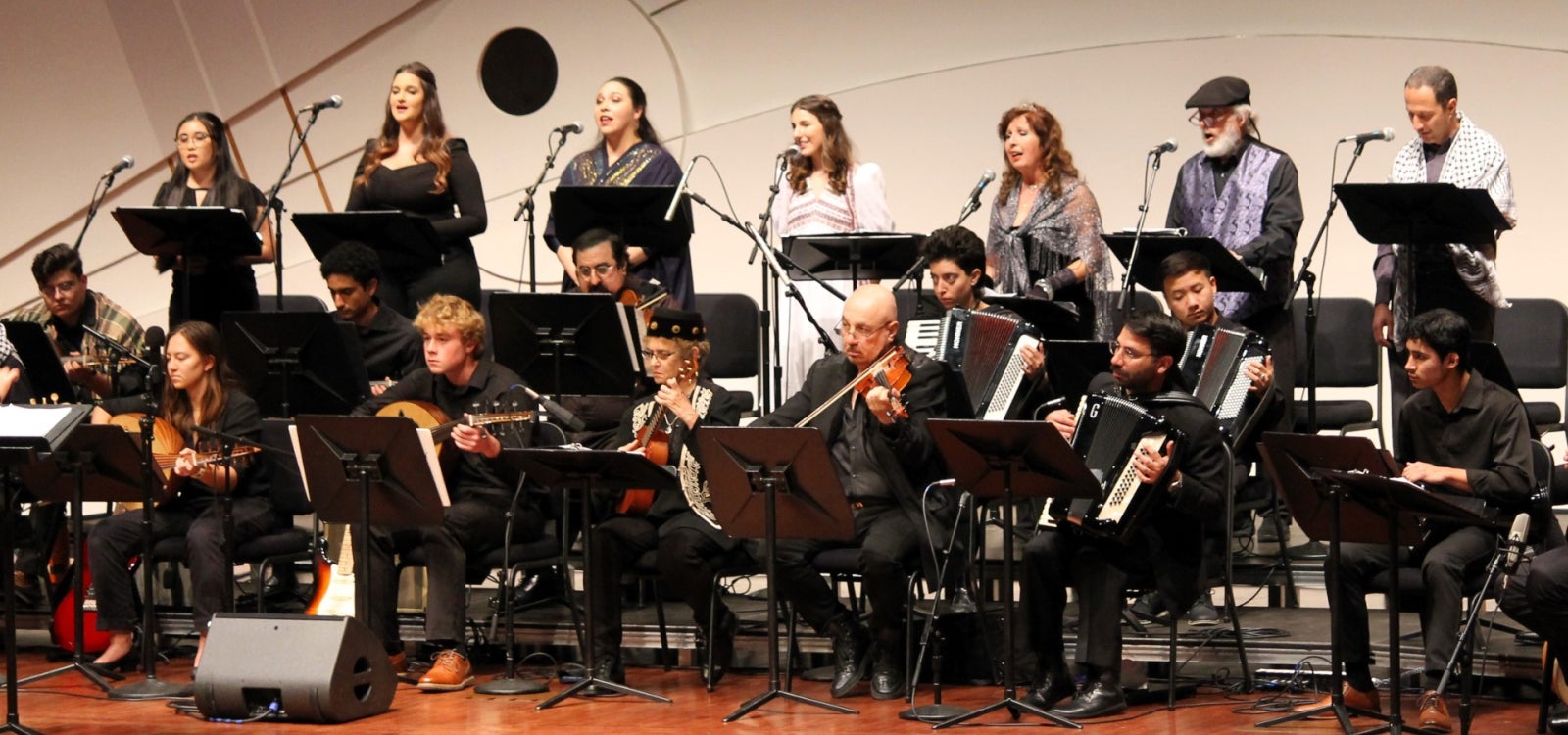 Musicians of the Cal Poly Arab Music Ensemble perform onstage at the PAC