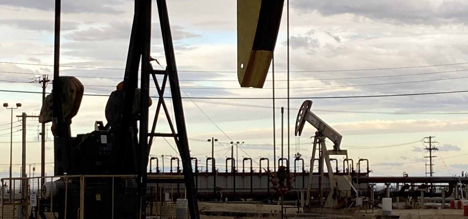 Plugged and abandoned oil wells near active oil pumps at the Aera Energy South Belridge site