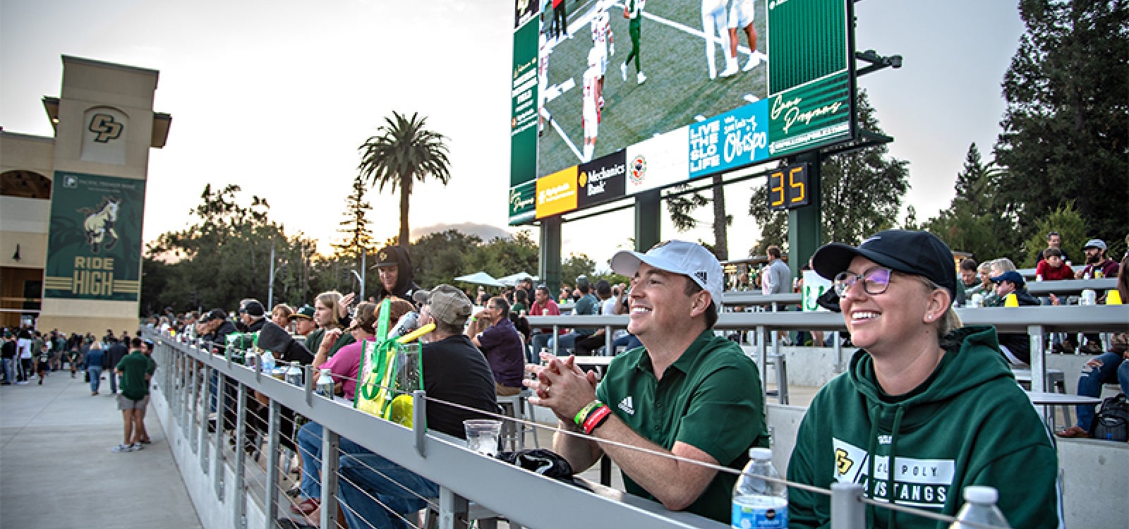 Cal Poly football fans enjoy watching a game last fall from the Cal Poly Partners Plaza on the north end of the stadium.