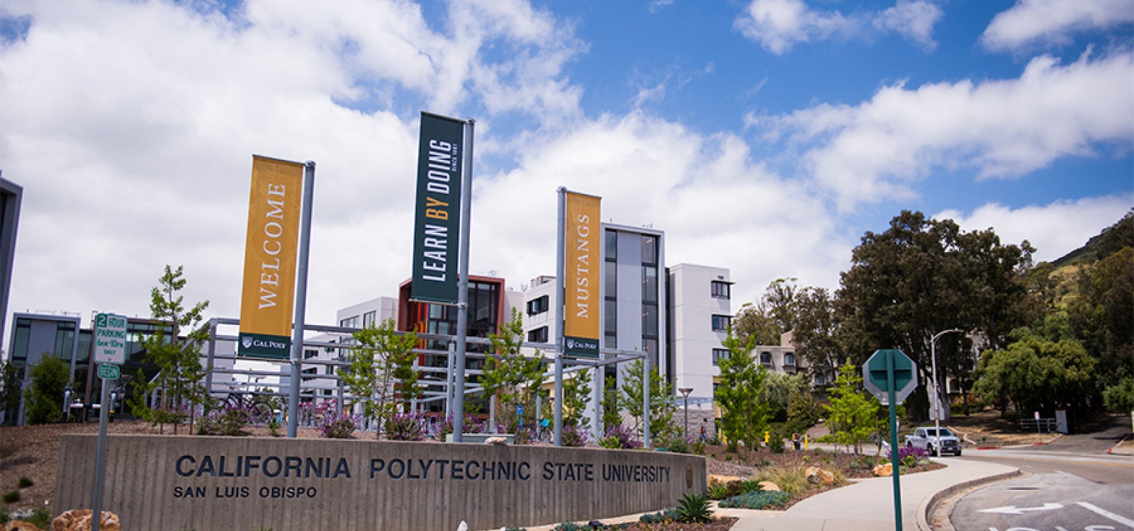 Three welcome banners greet visitors to the Cal Poly campus at its Grand Avenue entrance