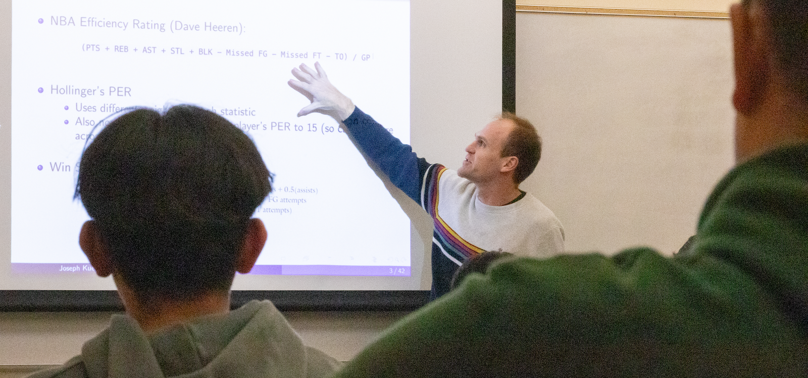 Professor Joseph Kuehn talks with students about using analytics in sports