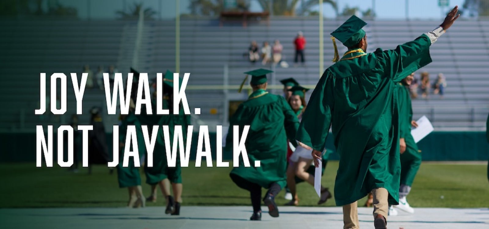 Students in graduation regalia walk and wave in photo with header: Joy Walk. Not Jaywalk.