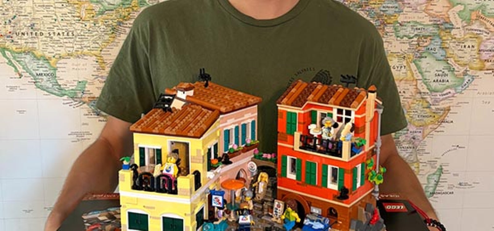Computer science student Alex Sahli holds the Lego Italian Riviera set he designed