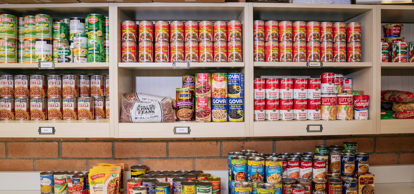 Canned food lines the shelving at the Cal Poly Food Pantry