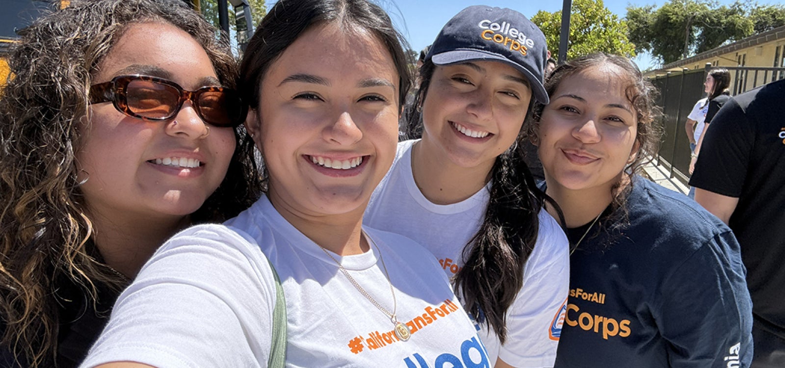 College Corps Fellows stop while working to take a selfie at a local elementary school site