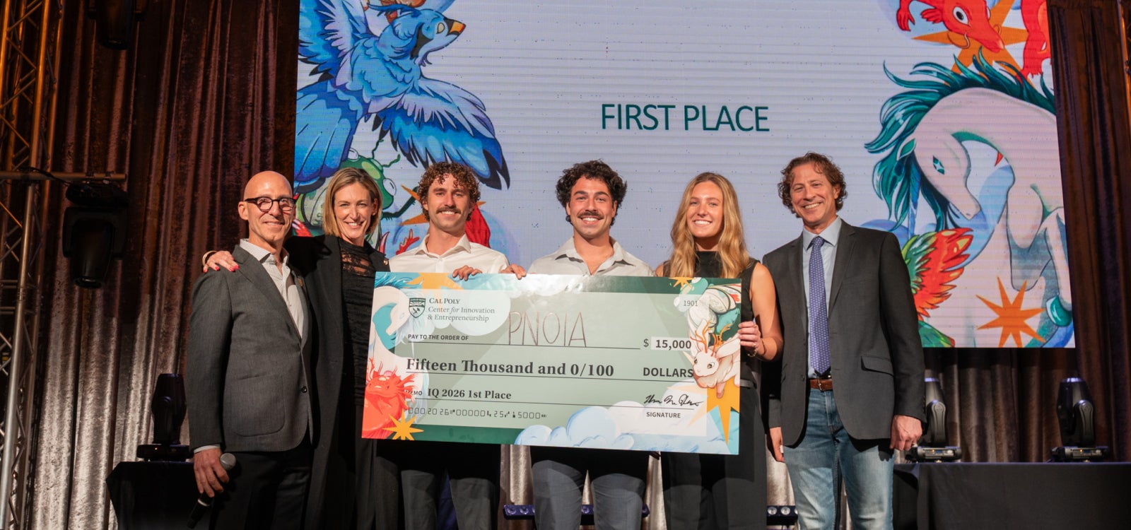 Developers of PNOIA receive the $15,000 top prize on stage