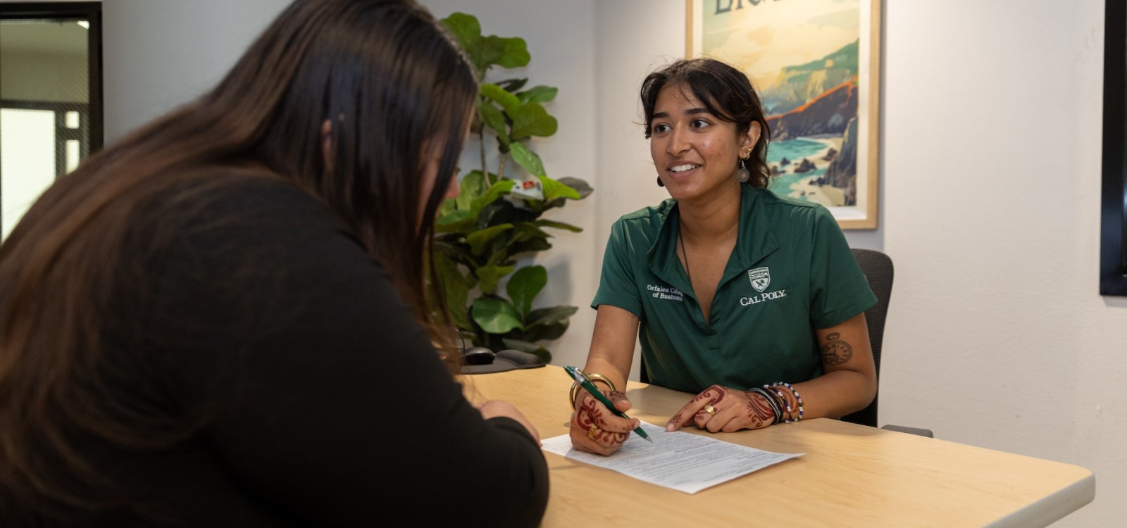 Career peer advisor Suvida Namboodiring assists a student