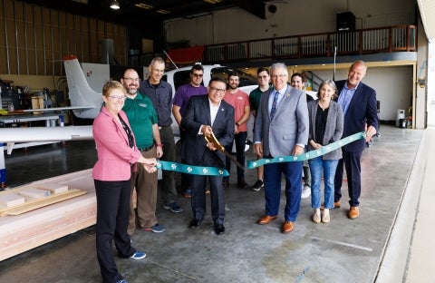 Congressman Carbajal and Cal Poly officials and students at a ribbon cutting
