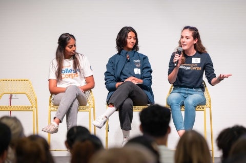 A trio of students from the stage address the crowd of #CaliforniansForAll College Corps students