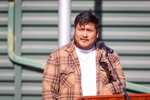 Student veteran David Gaspar-Martinez addresses attendees at the dedication of the new Military-Connected Students Center