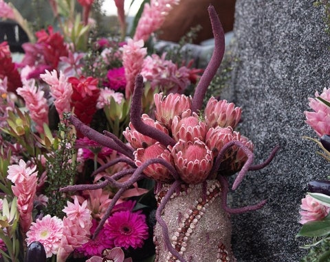 Details show colorful exotic flowers suggestive of underwater floral