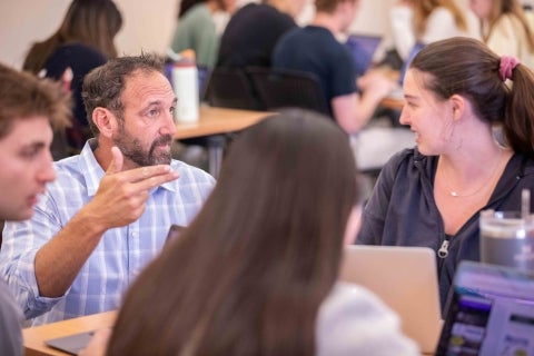 Randy Rovegno talks to students in his marketing projects class that he calls the Athlete Lab