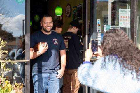 Cal Poly football player Cruz Rubiois filmed promoting Taqueria Santa Cruz with his marketing videographer