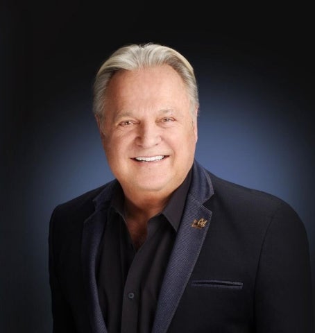 Alumni John Couch in a studio portrait