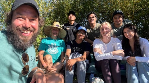 College Corps Fellows and Site Supervisors from City Farm SLO serving at a local farm