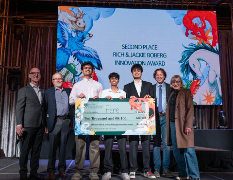 Developers of Fere receive the $10,000 Rich and Jackie Boberg Innovation Award with the award benefactors on the stage