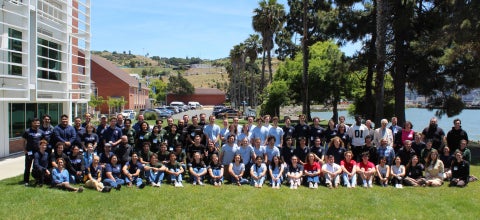 Participating teams in the Western Regional Collegiate Wind Competition at Cal Poly Maritime Academy gather on the lawn