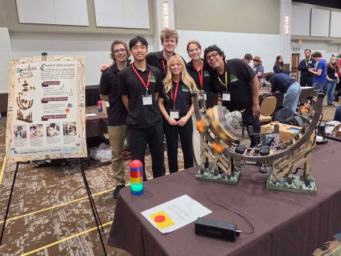 Members of the CAPED team pose with Round Table Twirl: A Knight’s Ascension at the 2026 Ride Engineering Competition in Hershey, Pennsylvania