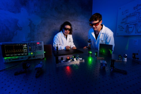 Assistant Professor Isinsu Toker collaborates with student James Mauck on the first laser setup built at Cal Poly