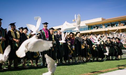 Doves are released at the start of each Cal Poly commencement ceremony