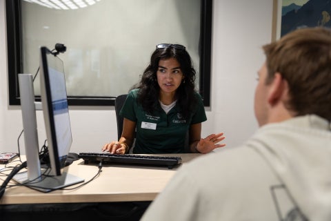 Lead career peer advisorYasna Mukundan assists a student