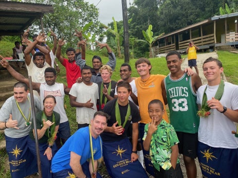 Capt. Samar B. Bannister, crew members and cadets visit a Fijian village during Summer Sea Term as part of the 2026 voyage aboard Training Ship Golden Bear.