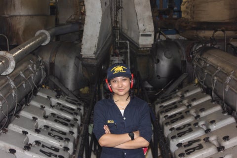 First-year engineering cadet Lotus Garcia experiences Learn by Doing in the engine room aboard Golden Bear.