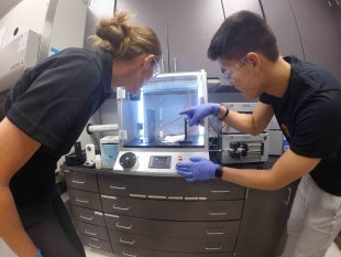 Professor Kristen Cardina land biomedical engineering student Squeaky Buentipo