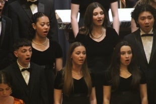 Female and male Cal Poly student singers perform at a 2023 choral concert